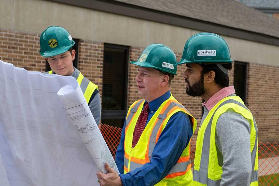 Students working with Professor Backus on a construction project